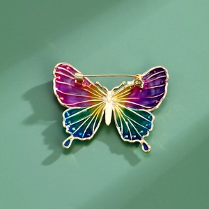 Exquisite enamel butterfly brooch with gold plating and back pin structure shown on teal