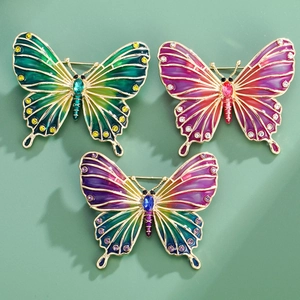 Exquisite enamel butterfly brooches set with crystal rhinestones in vibrant gradient colors