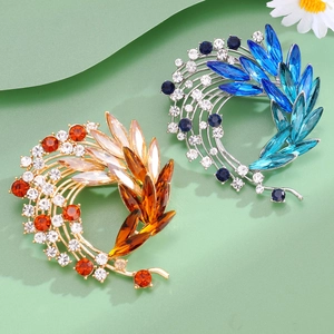 Elegant wreath flower brooch set with crystal rhinestones in gold and silver finishes