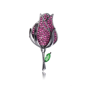 Broche fleur rose vintage avec cristaux roses et strass vert sur métal noir