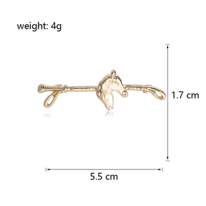 Vintage golden horse head brooch pin for coats with dimensions 5.5 cm by 1.7 cm