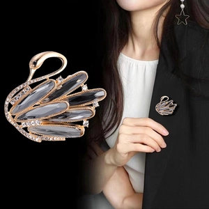 Elegant gold swan brooch with grey marquise crystals and rhinestones for suits