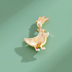 Detailed back view of the yellow duck brooch showing the golden metal pin and plating