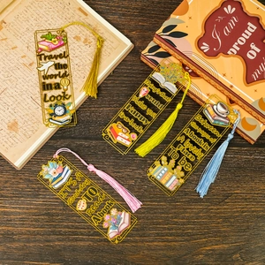 Macro detail of clear acrylic bookmarks with colorful tassels and artistic illustrations