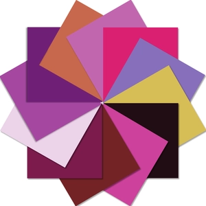 Top-down view of stacked square purple and multi-colored creative scrapbooking paper