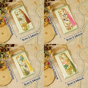 Vintage Chinese hollow metal bookmark set with tassels featuring cranes and koi fish scenery