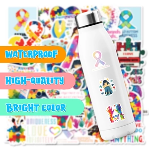 Waterproof autism awareness stickers with puzzle ribbon heart patterns on a white water bottle
