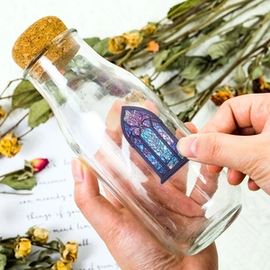 Stained glass style adhesive PET sticker on a clear glass bottle for DIY scrapbooking