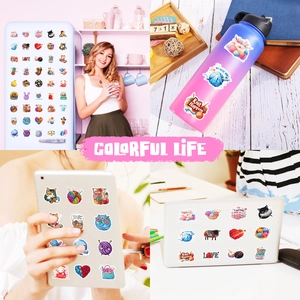 Waterproof yarn ball cat stickers shown decorating a laptop and a sports water bottle