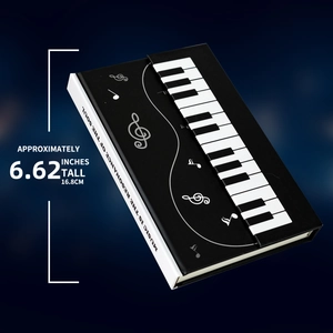 Detail view of the 6.62 inch piano-themed hardback notebook showing spine and dimensions