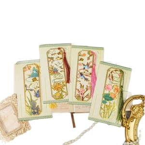Set of four vintage hollow metal bookmarks with traditional Chinese motifs and tassels
