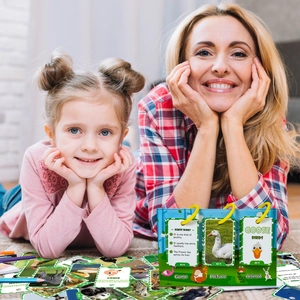 Close-up of mother and child using animal learning flashcards with a spiral-bound stand