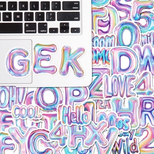 Detail of 3D balloon-style laser holographic alphabet stickers on a laptop surface