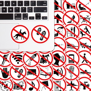 Detail of waterproof vinyl warning sign stickers on a laptop and flat lay collection