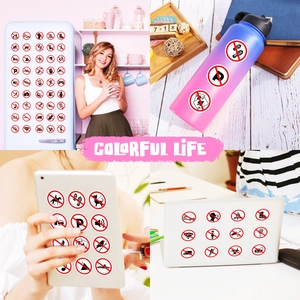 Detailed view of colorful prohibition sign stickers on laptop and home appliances