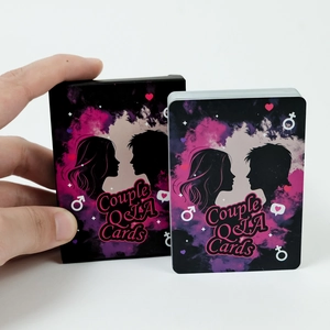 Detail shot of Couple Q&A Cards set with black printed box and stacked game cards