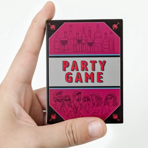 Close-up of a person holding the Party Game box featuring social gathering illustrations