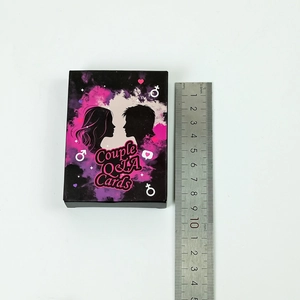 Couple Q&A Cards box measurement showing height of 9cm with a stainless steel ruler