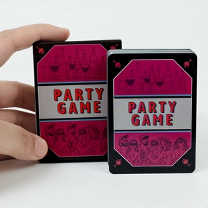 Close-up of Party Game cards set with black box and illustrated wine-themed cards