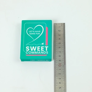 Macro shot showing Sweet Commands card game box size with ruler measurement detail