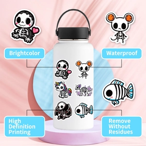 Stickers with cartoon skulls on a white cup, highlighting waterproof vinyl material