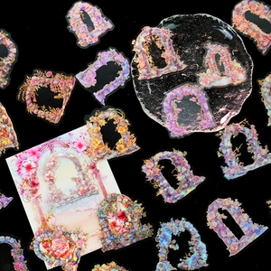 Detail van laser PET bloemenboog stickers met kleurrijke transparante lagen voor journals