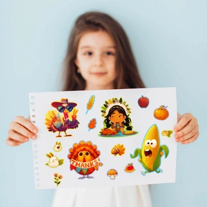 Close-up of girl holding Thanksgiving DIY stickers featuring turkey and pumpkin designs