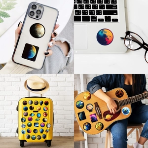 Solar system planet stickers applied on a laptop, suitcase, and guitar for decoration