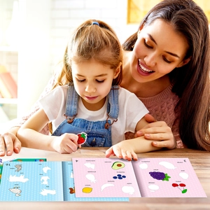 Detail of interactive kids sticker book showing fruit and animal learning activities