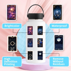 Close-up of waterproof galaxy stickers applied on a white stainless steel water bottle