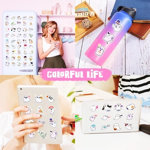 Ghost stickers shown on a white fridge, water bottle, tablet, and laptop surfaces