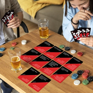 Friends playing Truth or Dare card game on wooden table with beer and social interaction