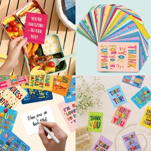 Close-up of colorful round-edge gratitude cards showing mixed patterns and lunchbox usage