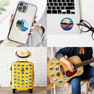 Autocollants de voyage décoratifs affichant des paysages sur laptop et valise