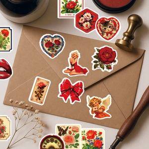 Macro detail of vintage rose stickers and retro heart decals on kraft paper background