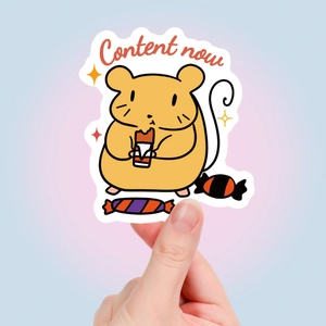 Close-up of a cute cartoon hamster vinyl sticker with Content Now text and candy details
