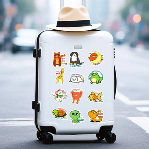 Cute waterproof animal stickers with inspiring text applied to a travel suitcase