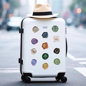 Retro wax seal stickers with metallic texture on white luggage for travel decor