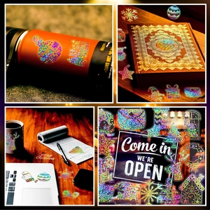Holographic Christmas stickers shown on a laptop and water bottle with glowing laser effects