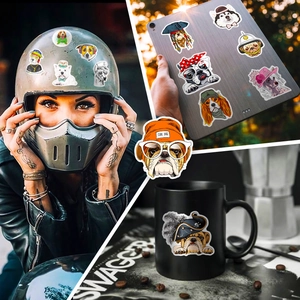 Close-up of cute cartoon dog stickers on helmet and laptop with hip hop style details