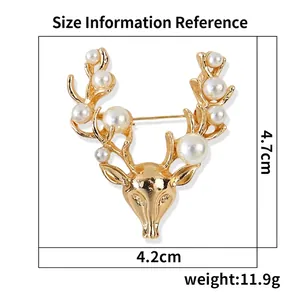 Golden reindeer head brooch with pearls showing 4.7cm by 4.2cm size measurements