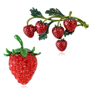 Elegant rhinestone strawberry brooch set with red crystals and green enamel leaves