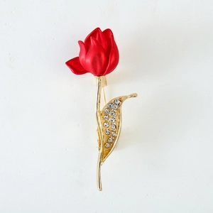 Vintage red tulip brooch with matte petals, gold stem, and sparkling rhinestone leaves