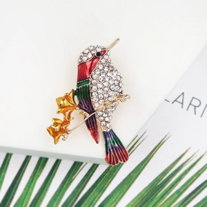 Exquisite hummingbird brooch with colorful enamel and sparkling rhinestones on branch