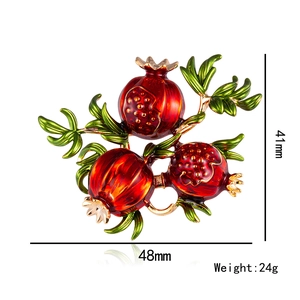 Vintage pomegranate brooch pin with red enamel fruit and golden leaves, 48mm width