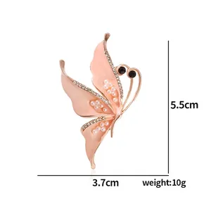 Elegant butterfly brooch with pink enamel pearls and crystals in 5.5cm x 3.7cm size