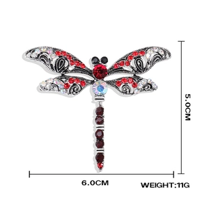 Detail view of dragonfly brooch with crystal inlay showing 5x6cm size dimensions