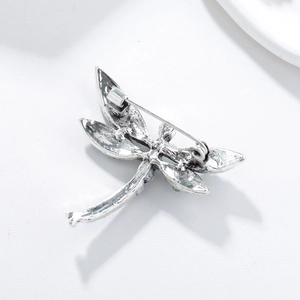 Detailed back view of vintage silver dragonfly brooch showing the secure pin fastener