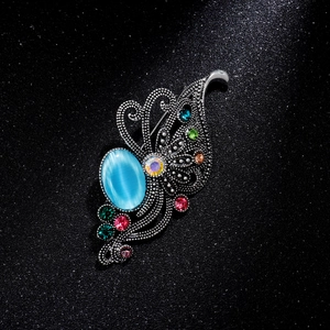 Vintage aurora purple butterfly brooch with blue cat eye stone and colored rhinestones