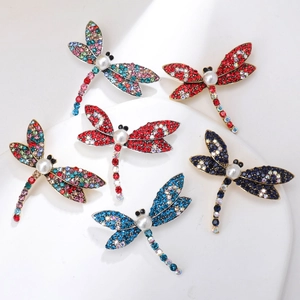Set of vintage gold dragonfly brooches with colorful rhinestones and imitation pearls